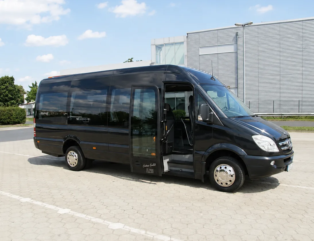 Black Driversline Mercedes-Benz Sprinter minibus with the entrance door open
