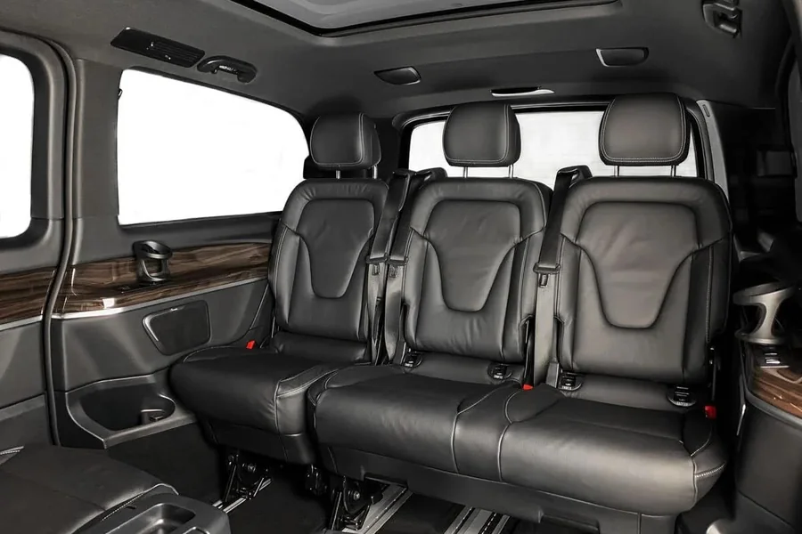 Rear seat row of the Mercedes-Benz V-Class with three black leather seats