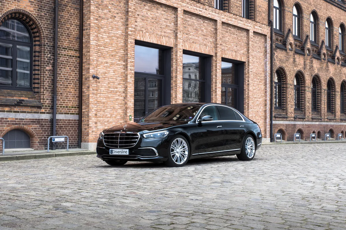 Mercedes-Benz S-Class sedan on cobblestones in front of Hamburg's Speicherstadt