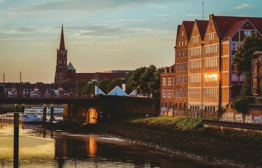 The Schlachte in Bremen on the Weser with a sailing ship and St Martini church